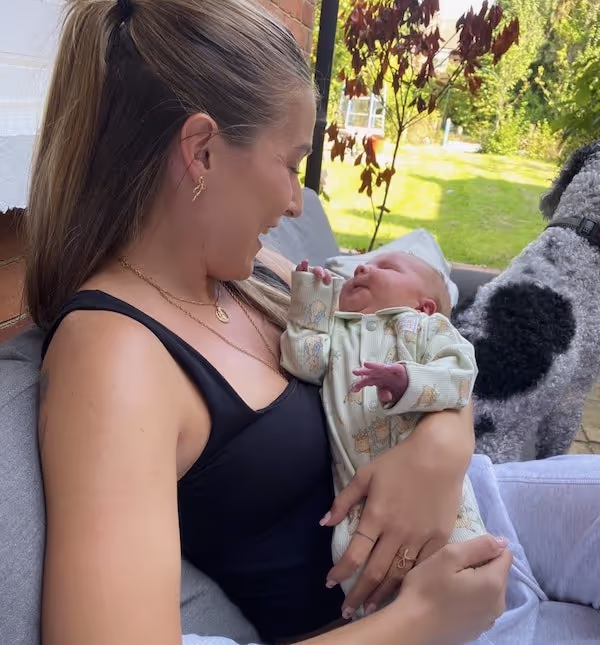Marley holding a baby